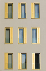 Hotel facade with golden shutters