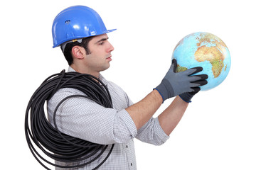 Electrician holding globe