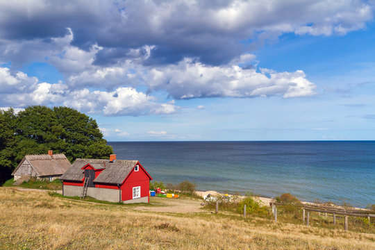 Traditional red Swedish cottage house at Baltic Sea