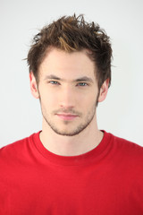 Fototapeta premium portrait of young man with neutral expression