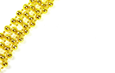 Background made of a brilliant celebratory beads of golden color