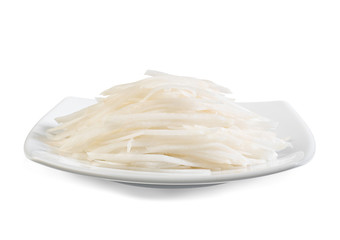 sliced white Chinese radish ready for cooking on the dish
