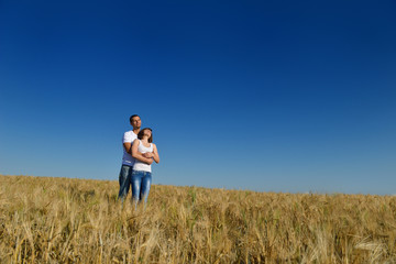 happy couple in wheat field