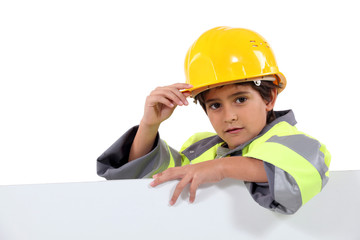 Little boy dressed as construction worker