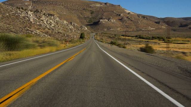 Driving on highway in Sierra-Nevada, time-lapse