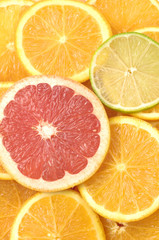 Oranges grapefruits and lemons slices background