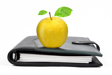 workbook with an Apple isolated on white background