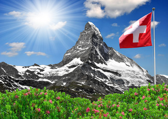 Beautiful mountain Matterhorn with Swiss flag - Swiss Alps