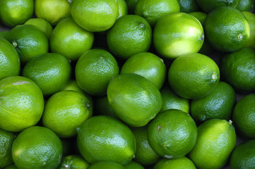 Fresh and green lemons background