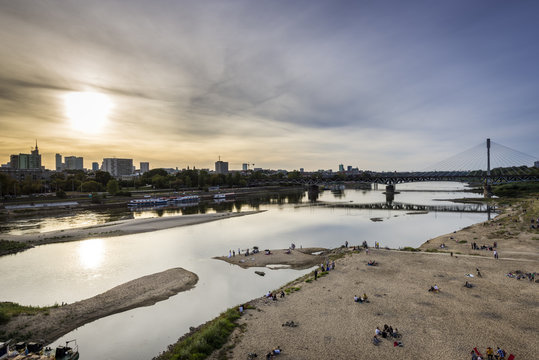 Fototapeta Warsaw city during sundown with Vistula river