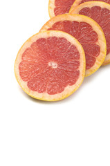 Fototapeta na wymiar Fresh grapefruit cut in pieces border