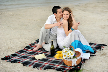 Lovers on picnic near the lake