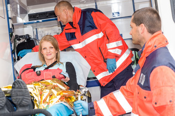 Woman with broken arm in ambulance paramedics © CandyBox Images
