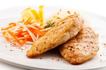 Grilled chicken breasts, rice and vegetables