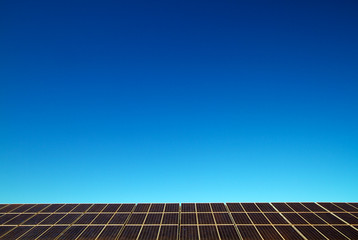 Solar panels against blue sky