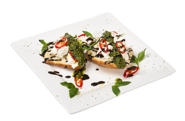 Fresh toast sandwiches with cheese and basilic and pesto.