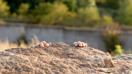 Child climbing rocks