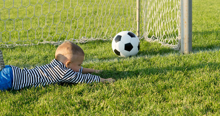 Small boy misses the goal