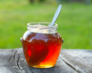 honey on wooden garden table