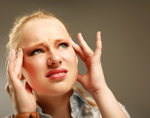 young woman suffering a migraine