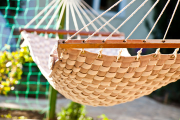 Hammock hanging in the sunny yard, close up photo