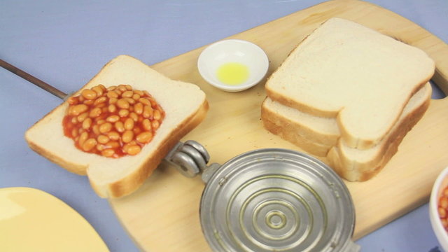 Part two of a sequence making a baked bean jaffle