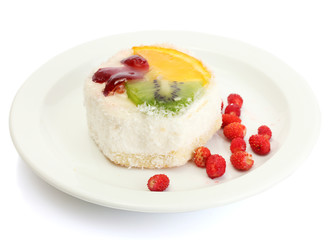 sweet cake with fruits on plate isolated on white