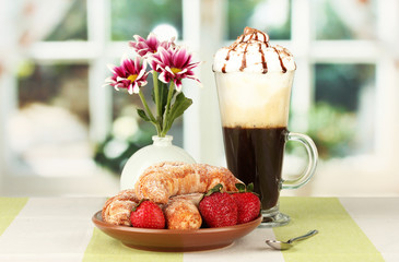 delicious bagels and fresh coffee on the table close-up