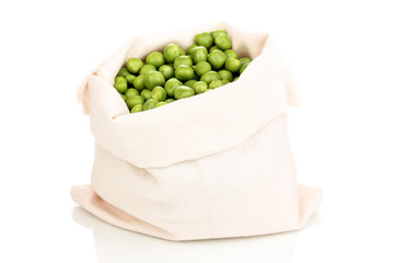 Green peas in bag isolated on white