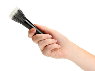 hand with black brush for make-up  isolated on white.