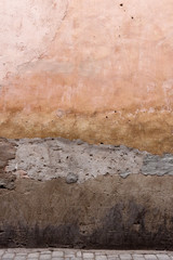 Texture of an old wall in the Souk of Marrakech, Morocco.