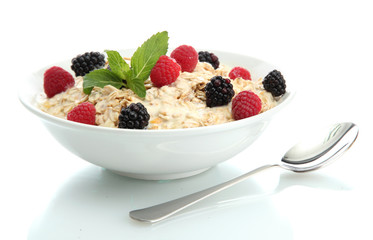 tasty oatmeal with berries, isolated on white