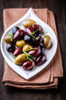 Marinated olives with rosemary on a plate