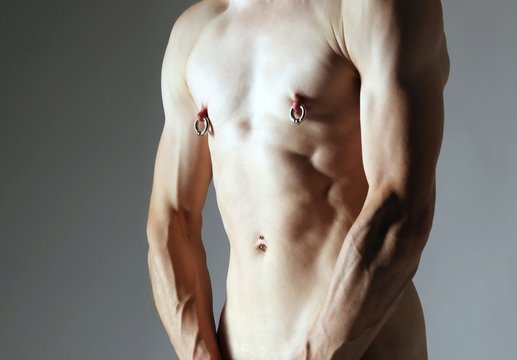 male body with piercings