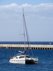 Catamaran anchored near jetty, Spain