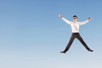 Happy businessman jumping