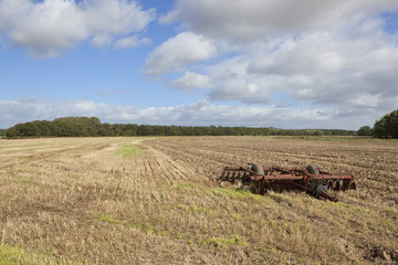 disc harrows in a stubble field