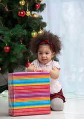 Girl holding Christmas gifts