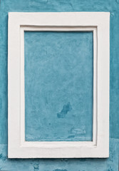 white frame on blue wall