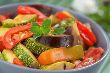 Ratatouille made of eggplant, zucchini, bell pepper and tomato