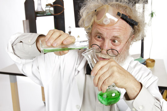 Mad scientist conducts chemistry experiment in his lab