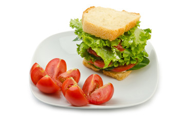 Tomatoes and cucumbers on white