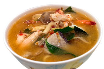Spicy Mixed Seafood Soup on white background.