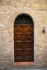 wooden residential doorway in Tuscany. Italy