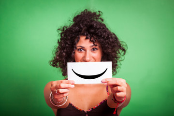 Young Woman with Smiley Emoticon on Green Background
