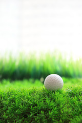 golf ball and green grass field