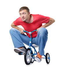 The curious man on a children's bicycle, on white background
