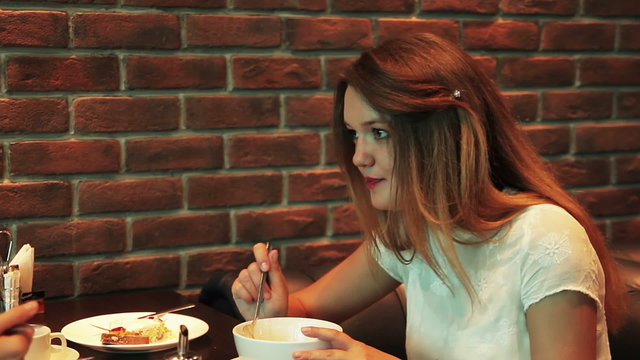 girl eating in a cafe