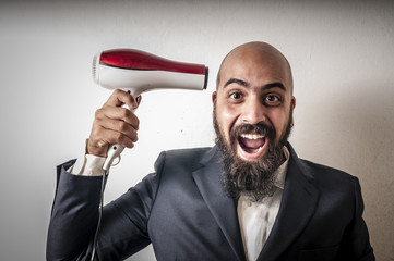 man bearded and jacket with hairdraier and funny expressions