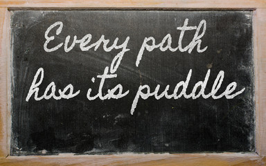 expression -  Every path has its puddle - written on a school bl